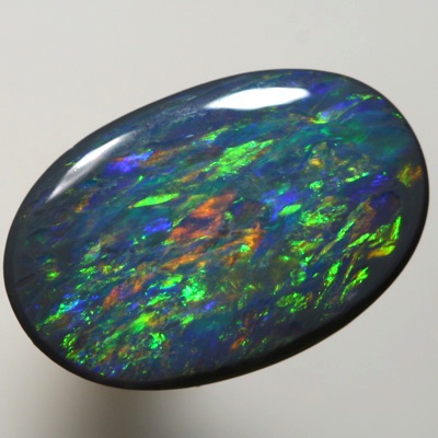 SOLID BLACK OPAL Strong gold copper fire. SEE VIDEO